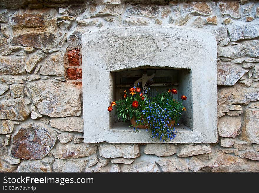 The old window with flowers