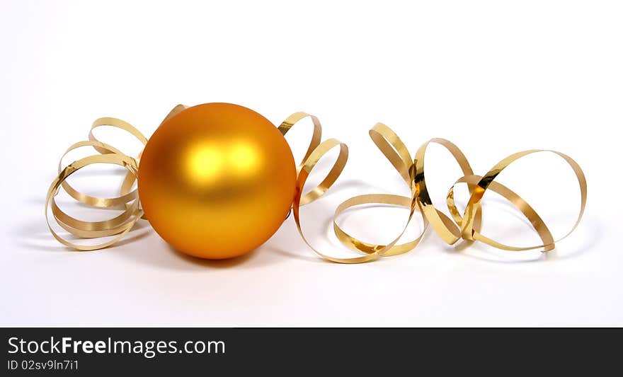 Yellow bauble with the gold ribbon on the white background. Yellow bauble with the gold ribbon on the white background