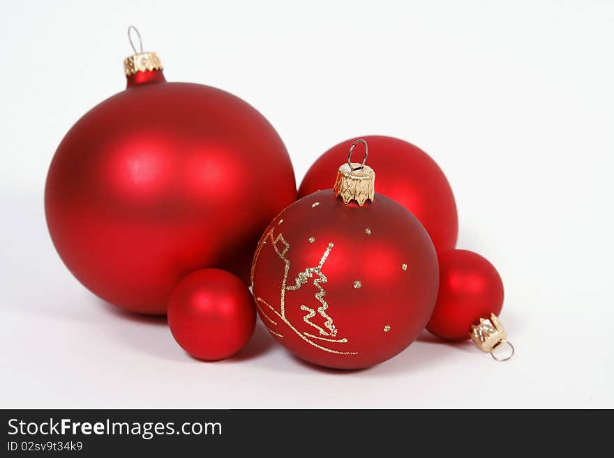 Red glass balls on the white background. Red glass balls on the white background