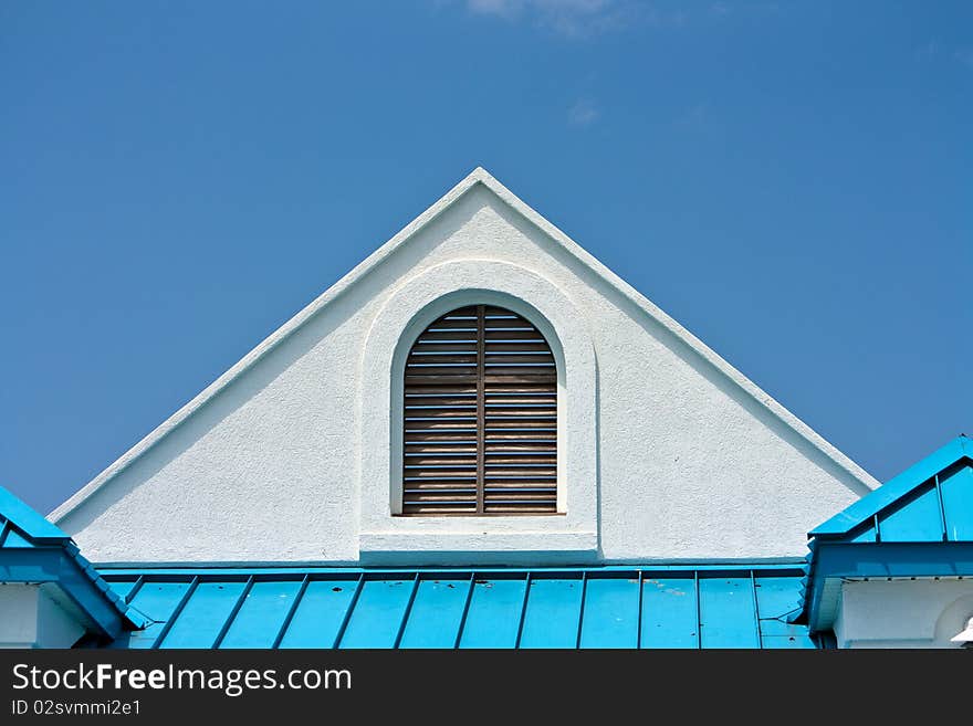 Bright blue and white triangle shapes of roof. Bright blue and white triangle shapes of roof.