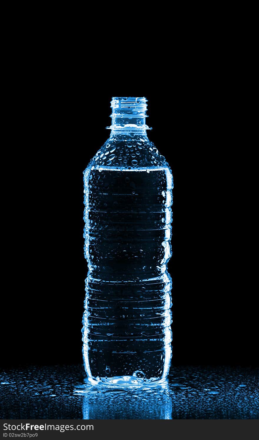 Plastic bottle of water isolated on black