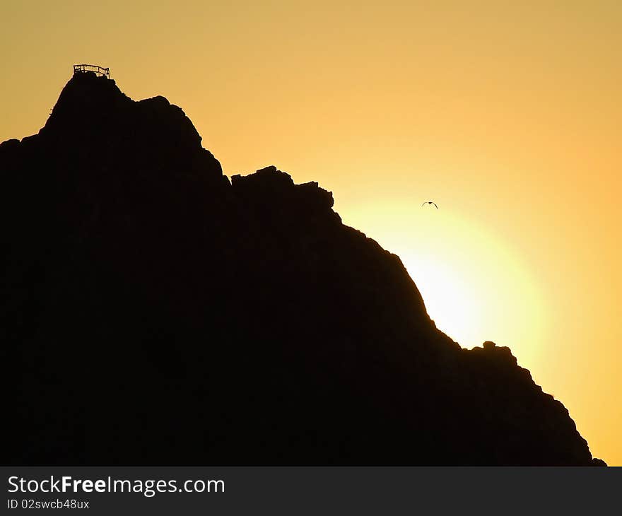 Beautiful sunrise in mountains. The yellow sky.