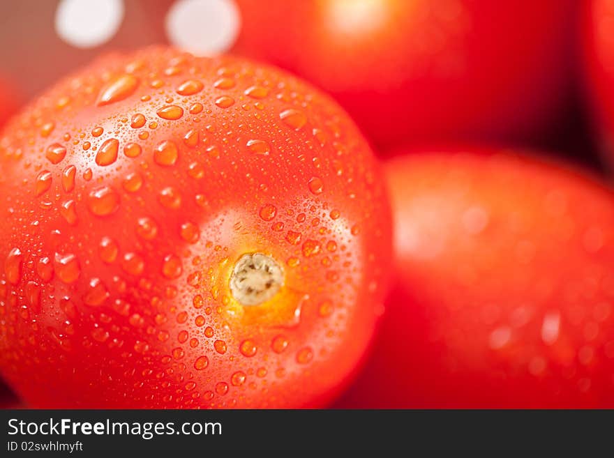 Vibrant Roma Tomatoes in Colander with Water