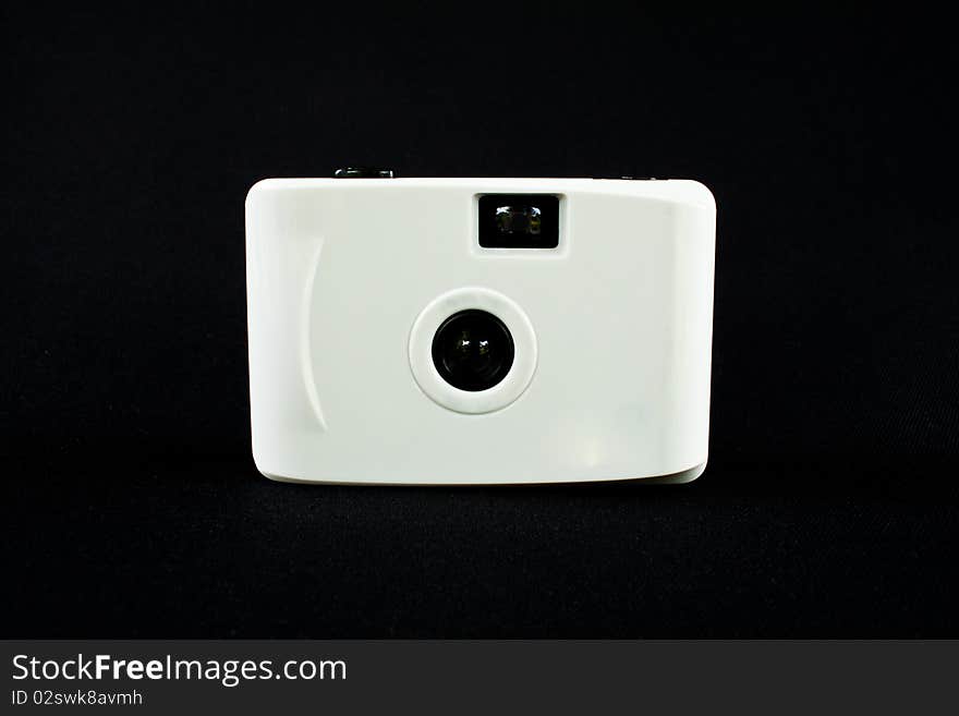 White digital camera isolate on black background