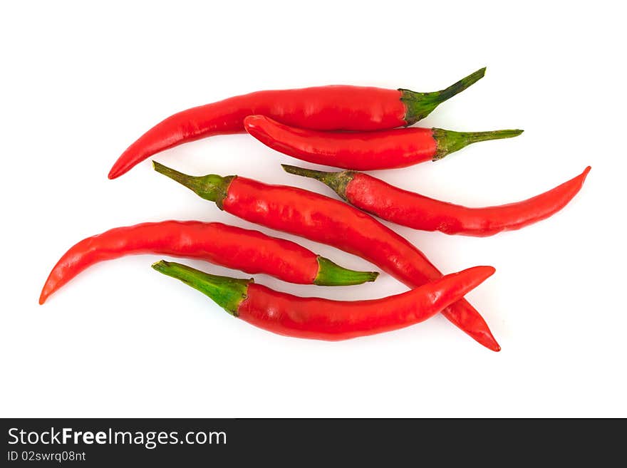 Heap of red hot chili pepper isolated on white background