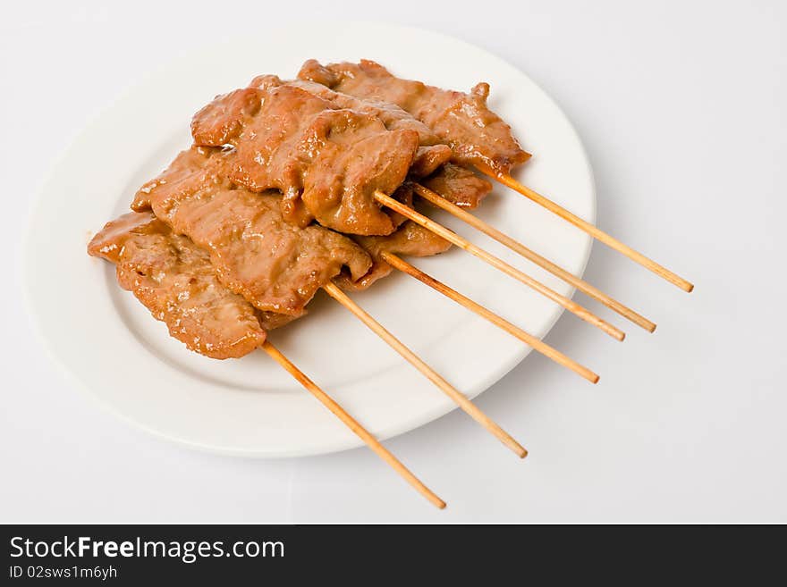 Barbecued meats on white dish,delicious of Thai food