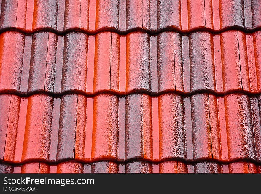 Red and black roof-tiles on the rainy day