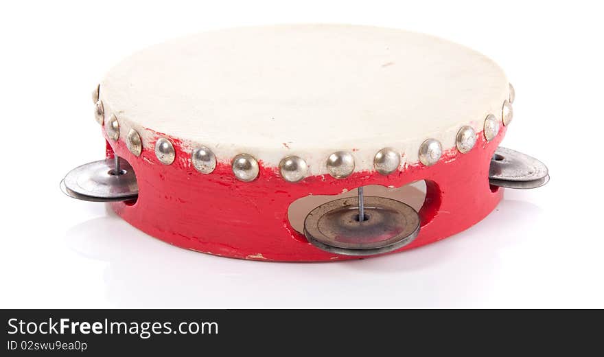 A red wooden tambourine isolated over white