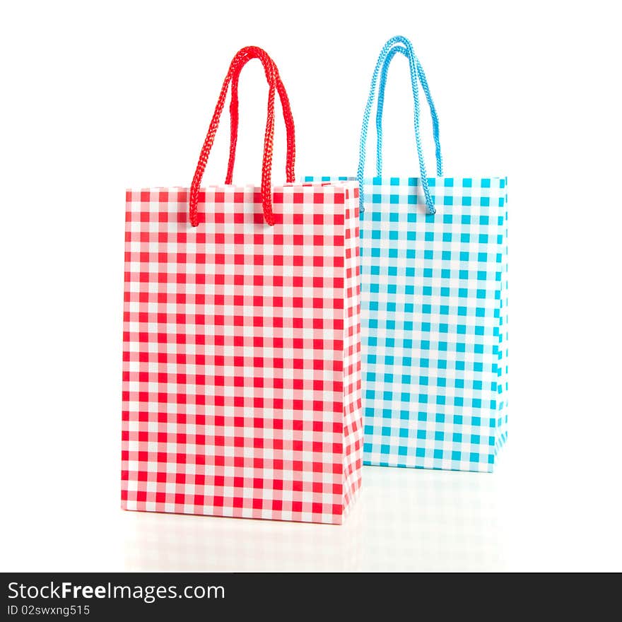 A red and blue white checkered gift bag isolated on white background. A red and blue white checkered gift bag isolated on white background