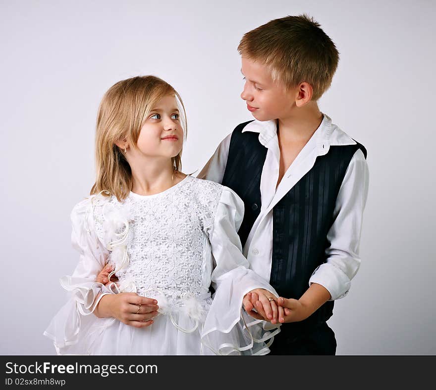 Little bride and groom, studio shot