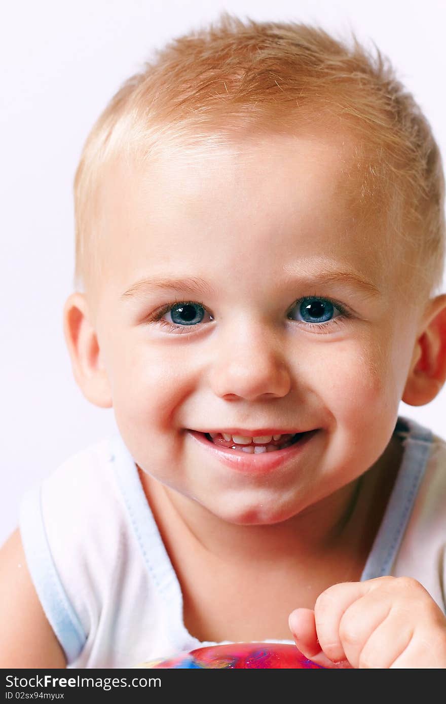 Portrait of happy boy, studio shot