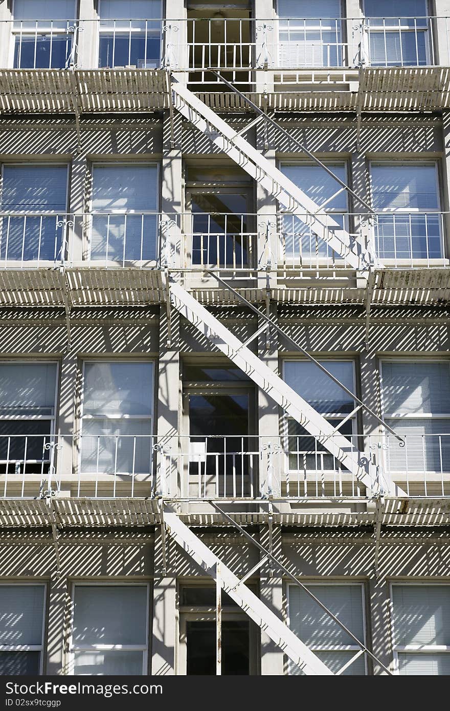 Building exterior fire escape metal staircase. Building exterior fire escape metal staircase.