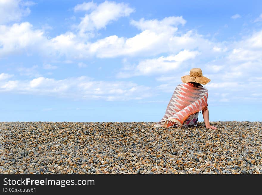 Young woman on the beach. North sea.