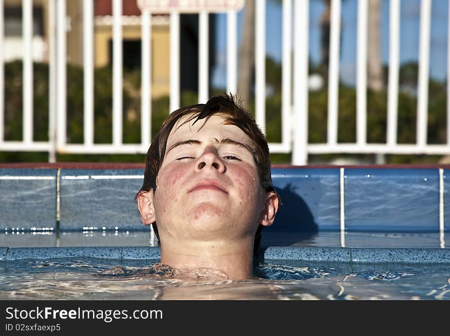 Relaxing child with closed eyes at the pool. Relaxing child with closed eyes at the pool