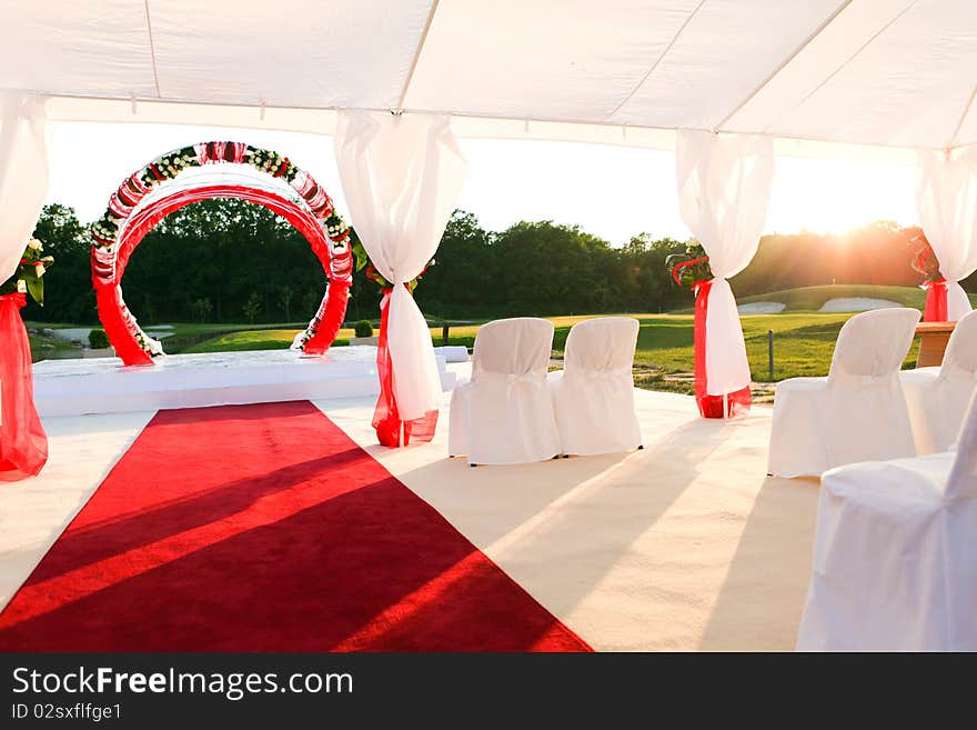 Visiting ceremony with white decoration and red carpet