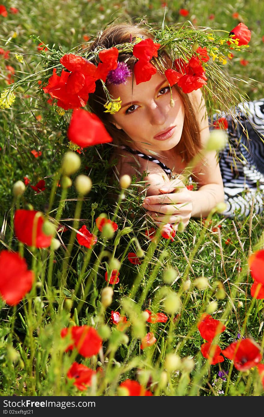 Woman and circlet of flowers