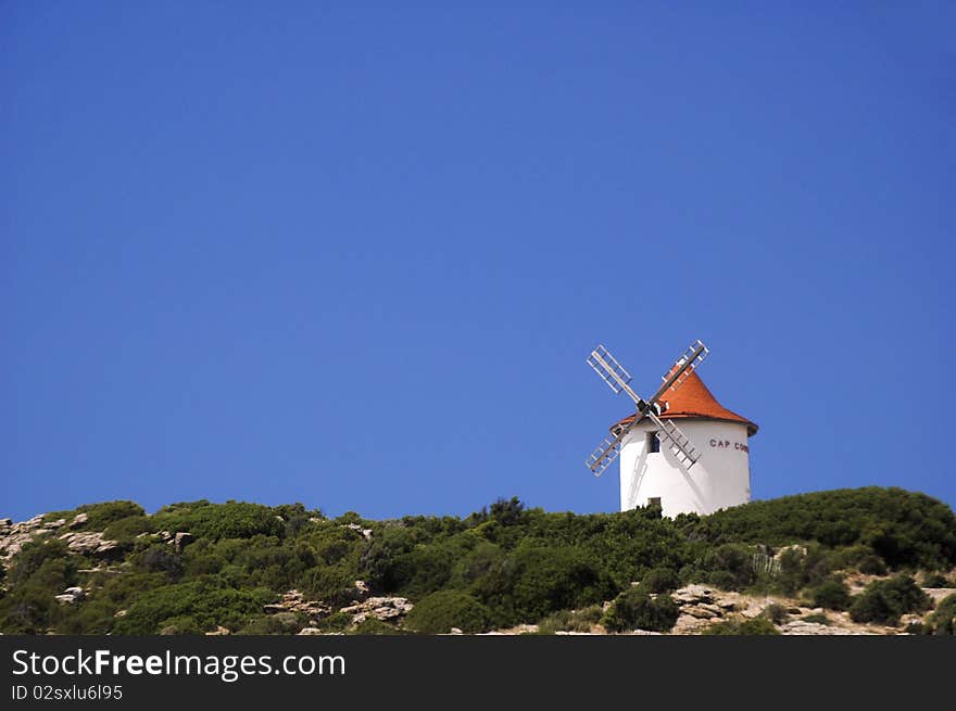 Windmill on a bushed mountain