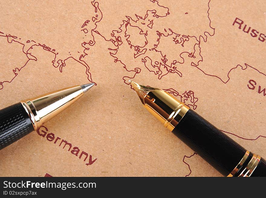 Two pens putting on a European map, means business and travel concept. Two pens putting on a European map, means business and travel concept.