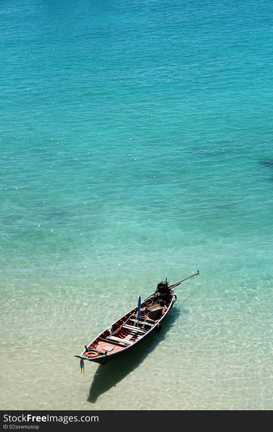 Top view A long tail boat sits in Tao island, Thailand