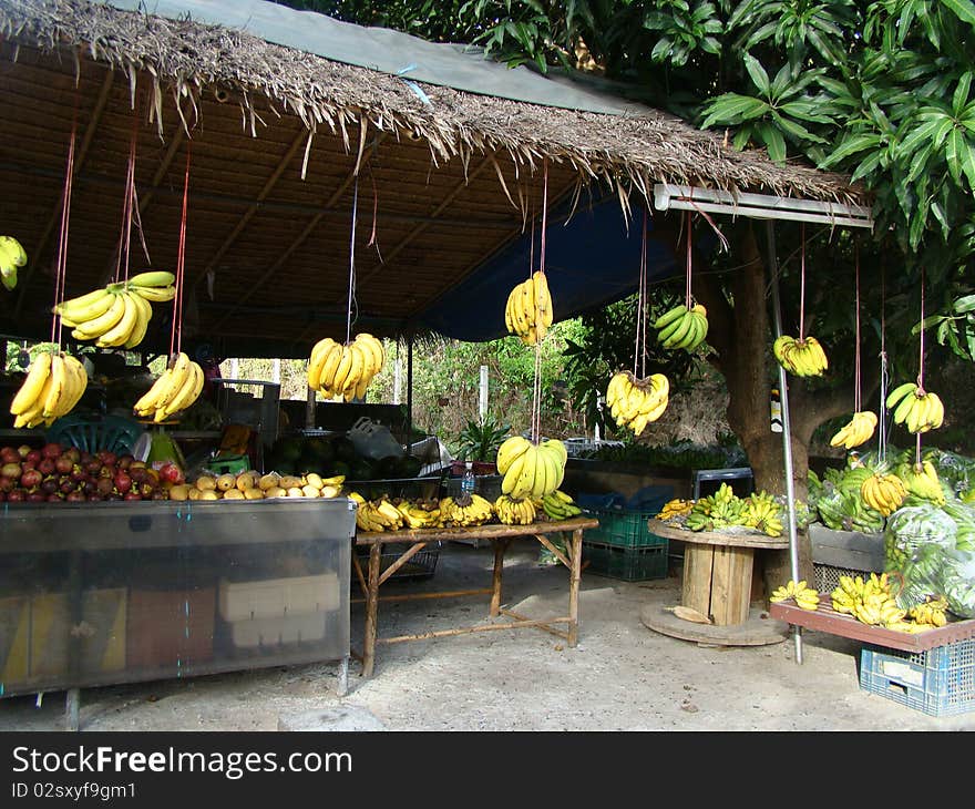 Thai market seeling vegtables and lots of bananas