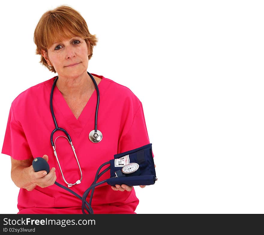 Nurse Stitting While Holding A Blood Pressure Monitor. Nurse Stitting While Holding A Blood Pressure Monitor