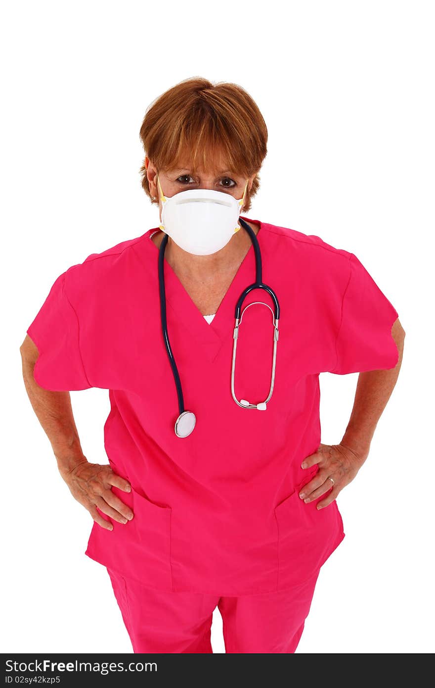 Nurse In Her 50's With Mask Looking Up. Nurse In Her 50's With Mask Looking Up