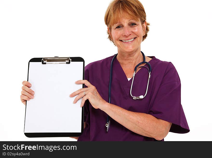 Smiling Nurse In Her 50's Holding Clipboard. Smiling Nurse In Her 50's Holding Clipboard