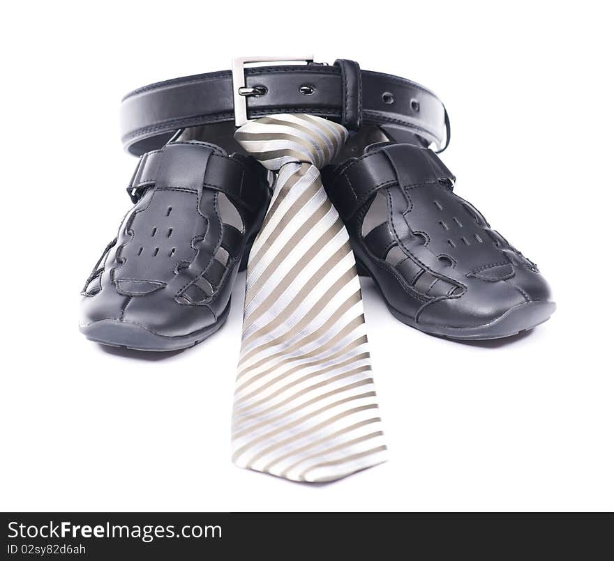 New black belt, sandals and cravat isolated on white background. New black belt, sandals and cravat isolated on white background