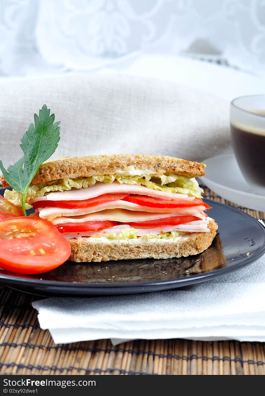 Fresh and delicious classic club sandwich over a white glass dish with coffee. Fresh and delicious classic club sandwich over a white glass dish with coffee