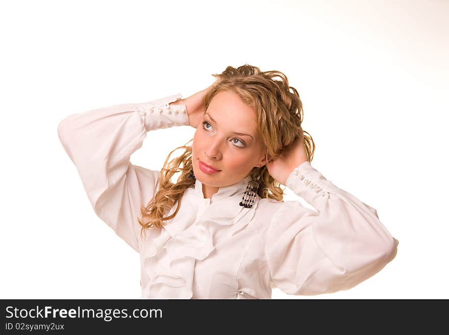 A portrait of beautiful young business-woman is in a white smock. A portrait of beautiful young business-woman is in a white smock