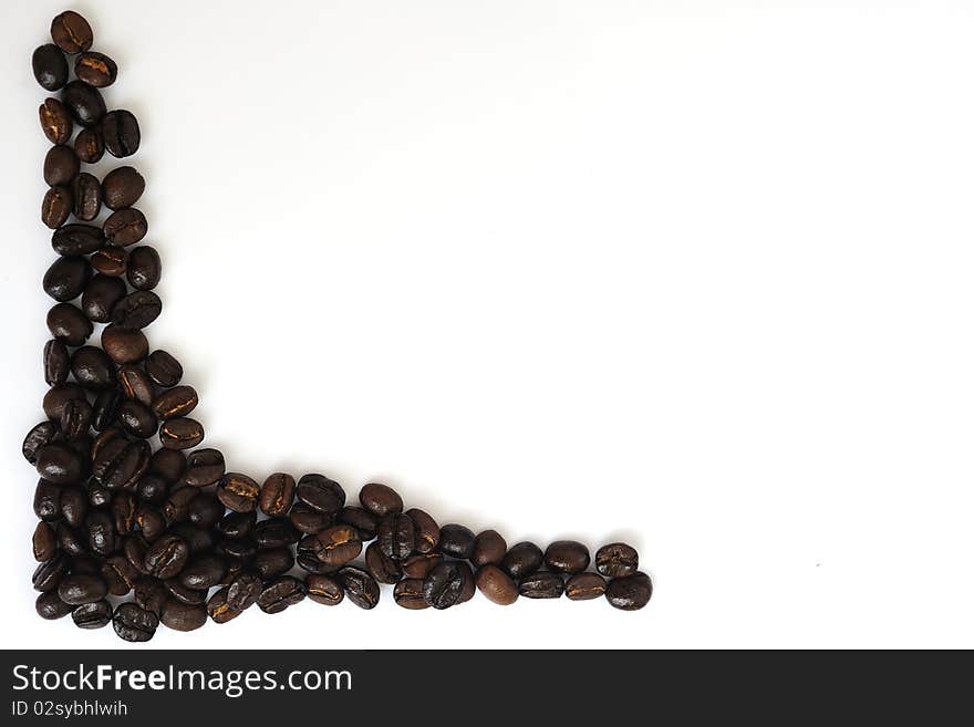 Coffee beans close-up in white background.