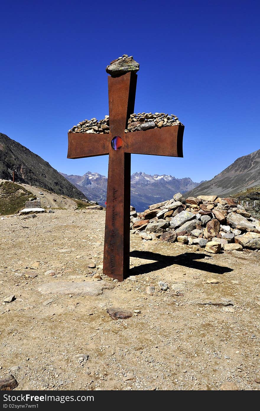 Senior cross on the mountain in the saddle in the Tyrolean Alps Timmelsjoch. Senior cross on the mountain in the saddle in the Tyrolean Alps Timmelsjoch