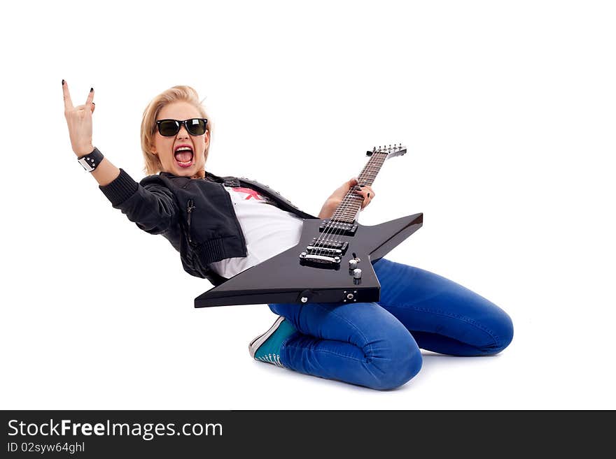 Rock and roll girl playing an electric huitar over white