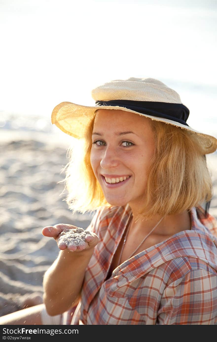 Portrait of beautiful blonde girl in cap