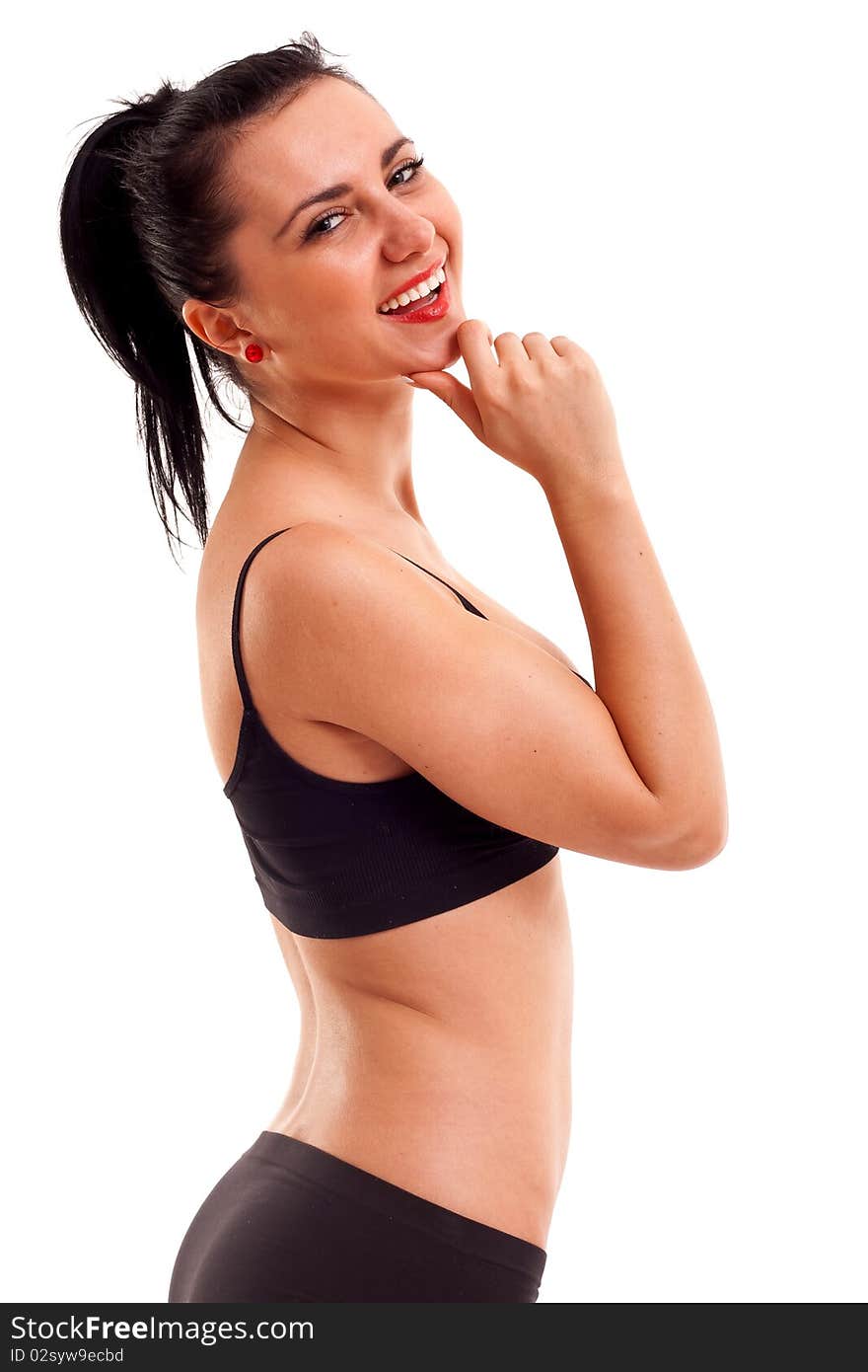 Portrait of a happy young healthy woman standing over white background