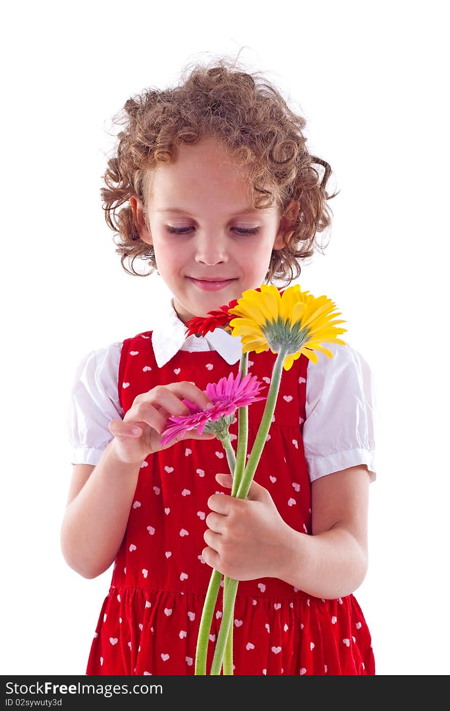 Girl sniffs some flowers. Isolated on white background