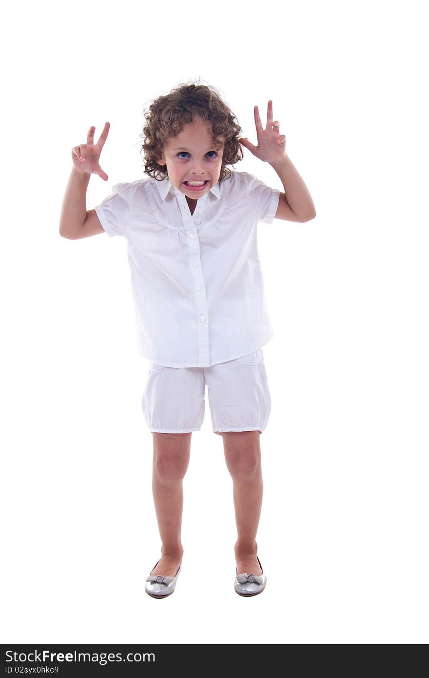 Pretty little girl making a funny face over white