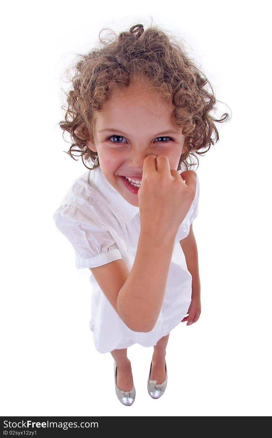 Cute little girl picking her nose over white - wide angle picture