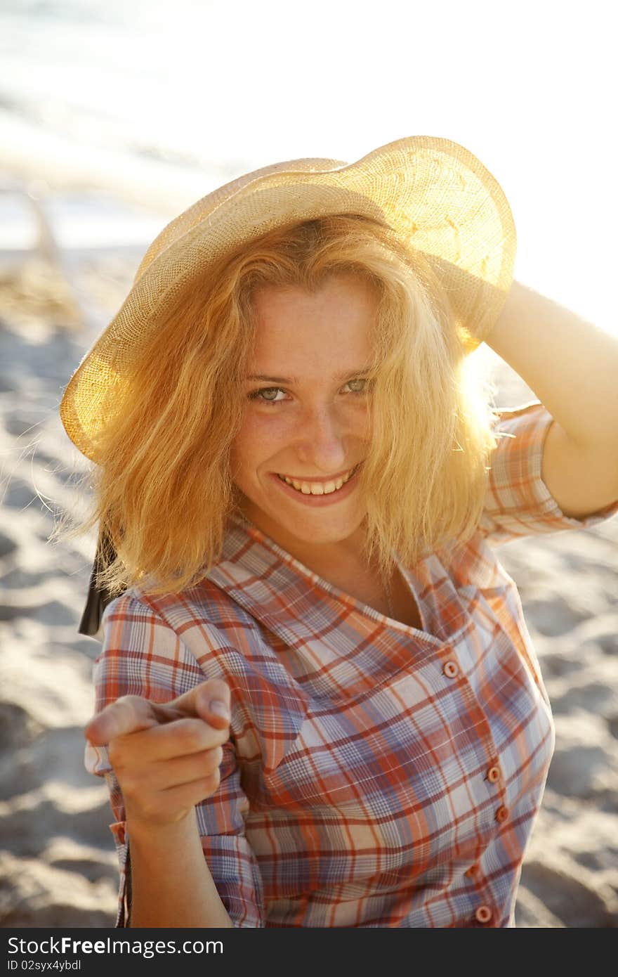 Portrait of beautiful blonde girl in cap