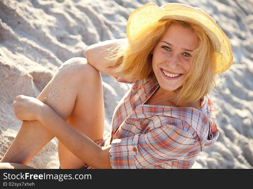 Portrait of beautiful blonde girl in cap