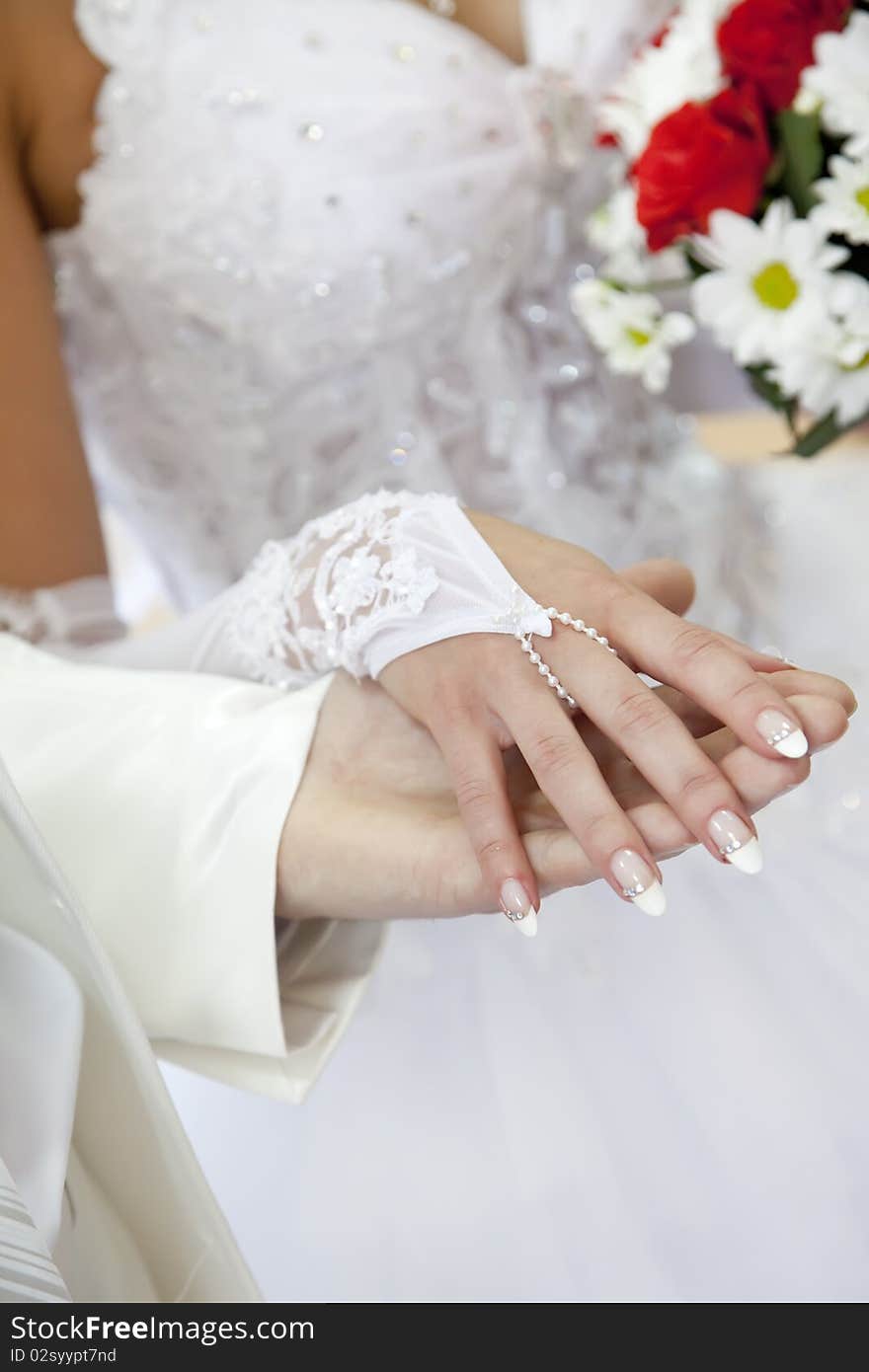 Bridegroom keeping bride hand