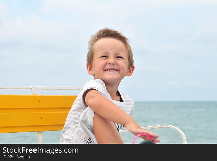 Little cute boy on the beach