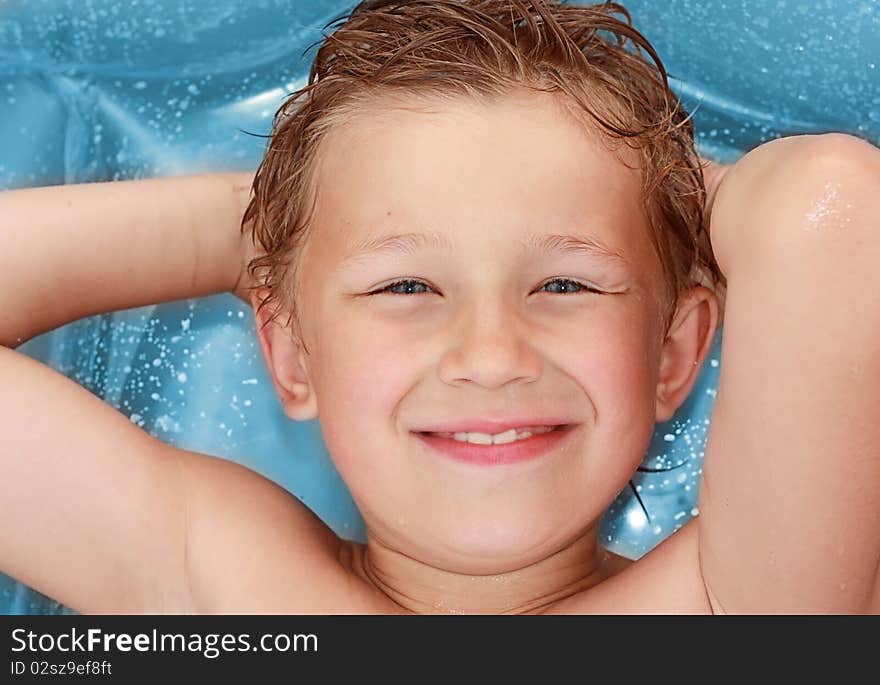 Young boy lying on the beach