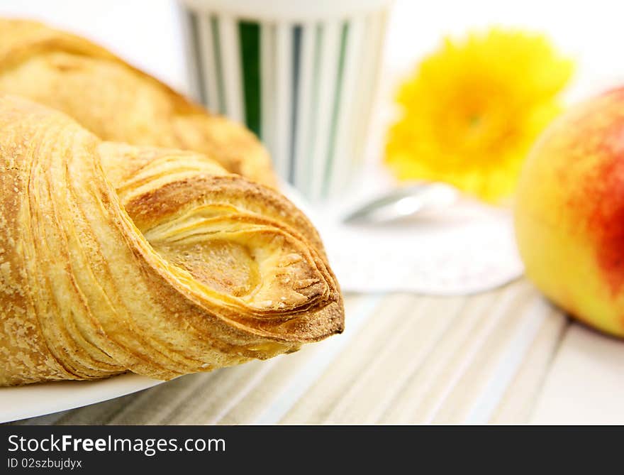 Fresh croissant closeup on breakfast table