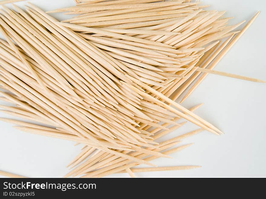 Photo of a hip of toothpicks, spillaged on the table.