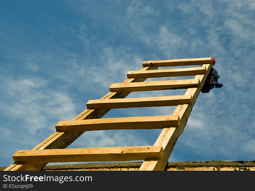 Photo of wooden staircase that leads up into the sky