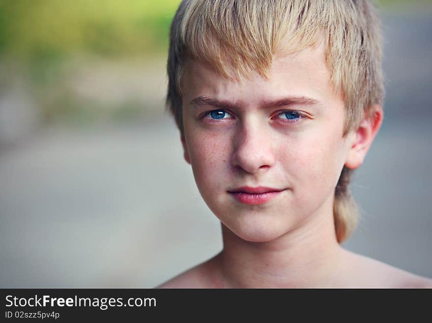 The Serious Boy With Blue Eyes On The Nature