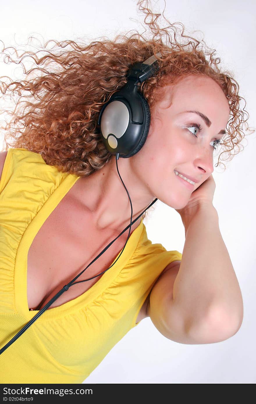 Smiling young girl listening to music