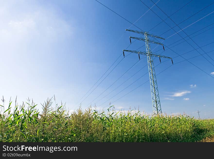 Electrical pylon over blue sky