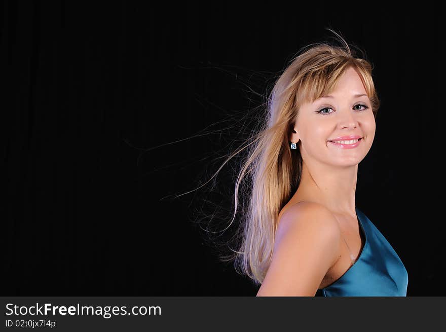 Portrait of a young girl on a black background